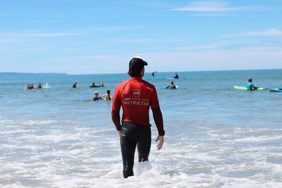 surf instructor on beach