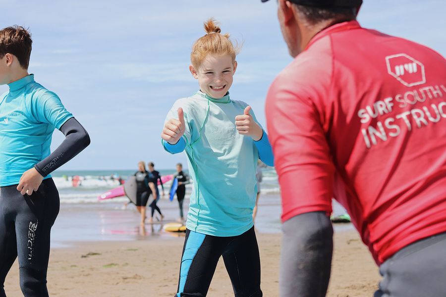 teacher teaching surfing