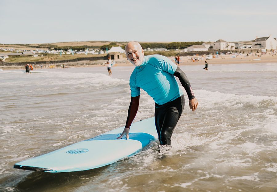 guy holding a surf board