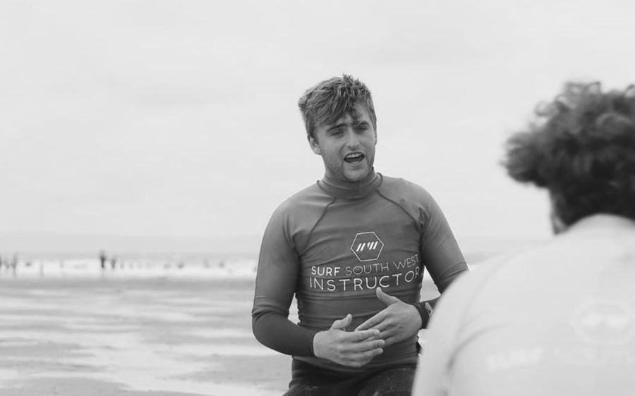 teacher teaching surfing