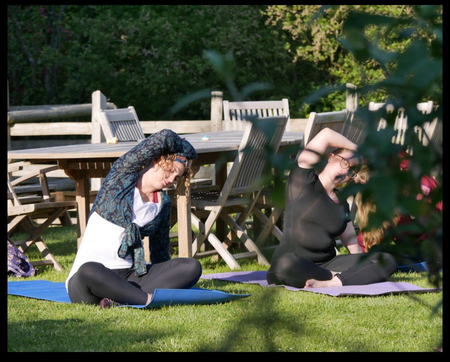 people doing yoga on holiday
